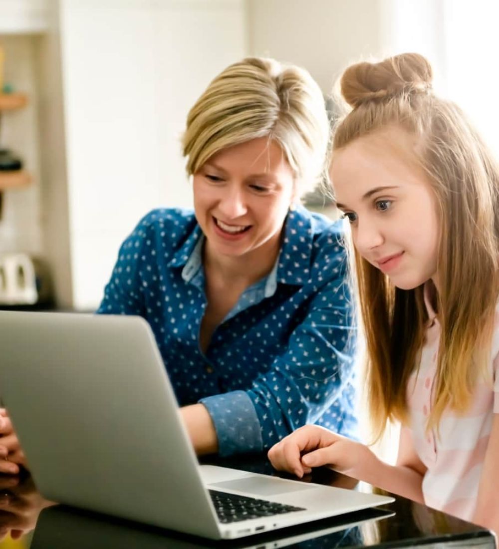 Teen and mom on computer